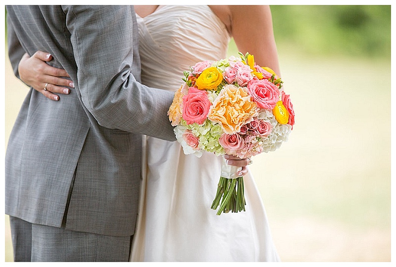 Coral, pink, peach, yellow, and green wedding flowers